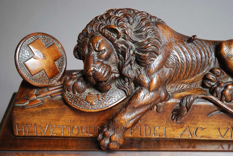 Swiss A Black Forest linden wood carving of a lion