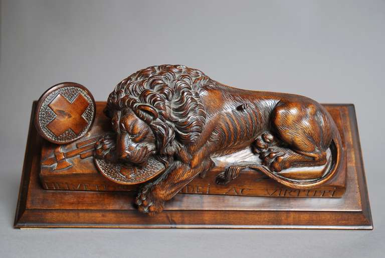 Carved A Black Forest linden wood carving of a lion