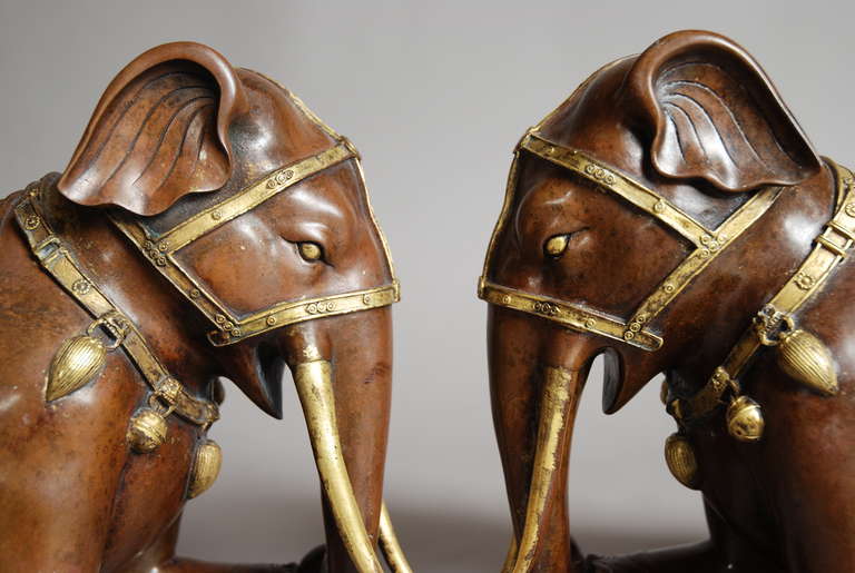 Pair of Chinese Kneeling Bronze and Gilt Elephants