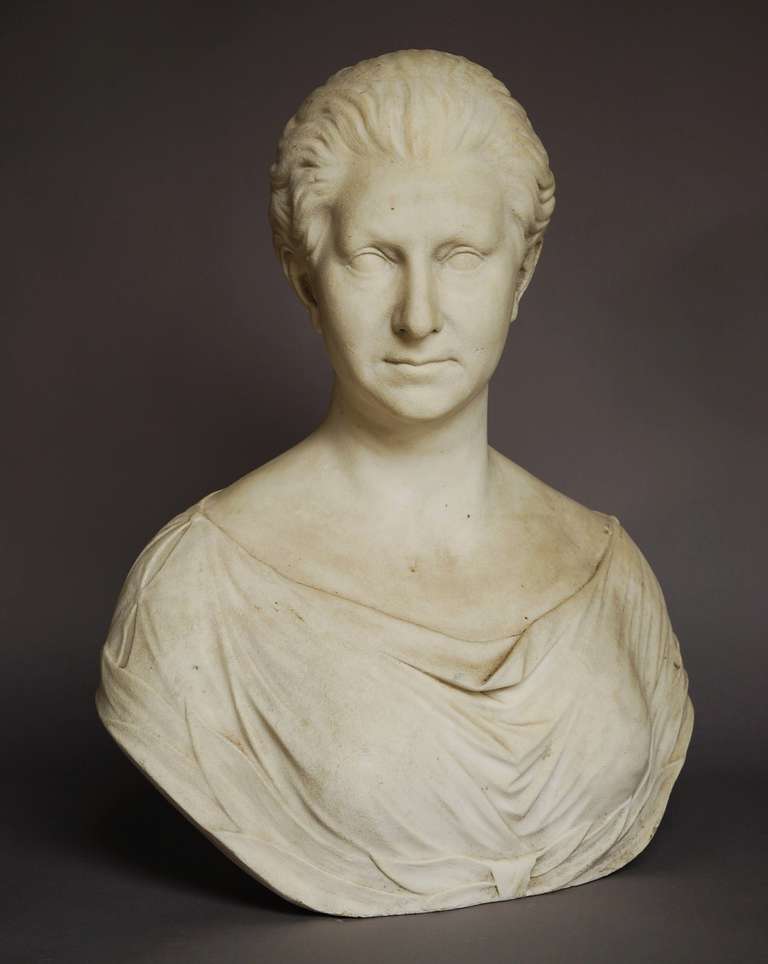 A fine quality late 19th century life size marble bust of Queen Victoria. This piece portrays her without a tiara or crown but instead with a decorative bun to the back of her hair. This sculpture is signed A. Davidson (1841-1925) Inverness 1879,