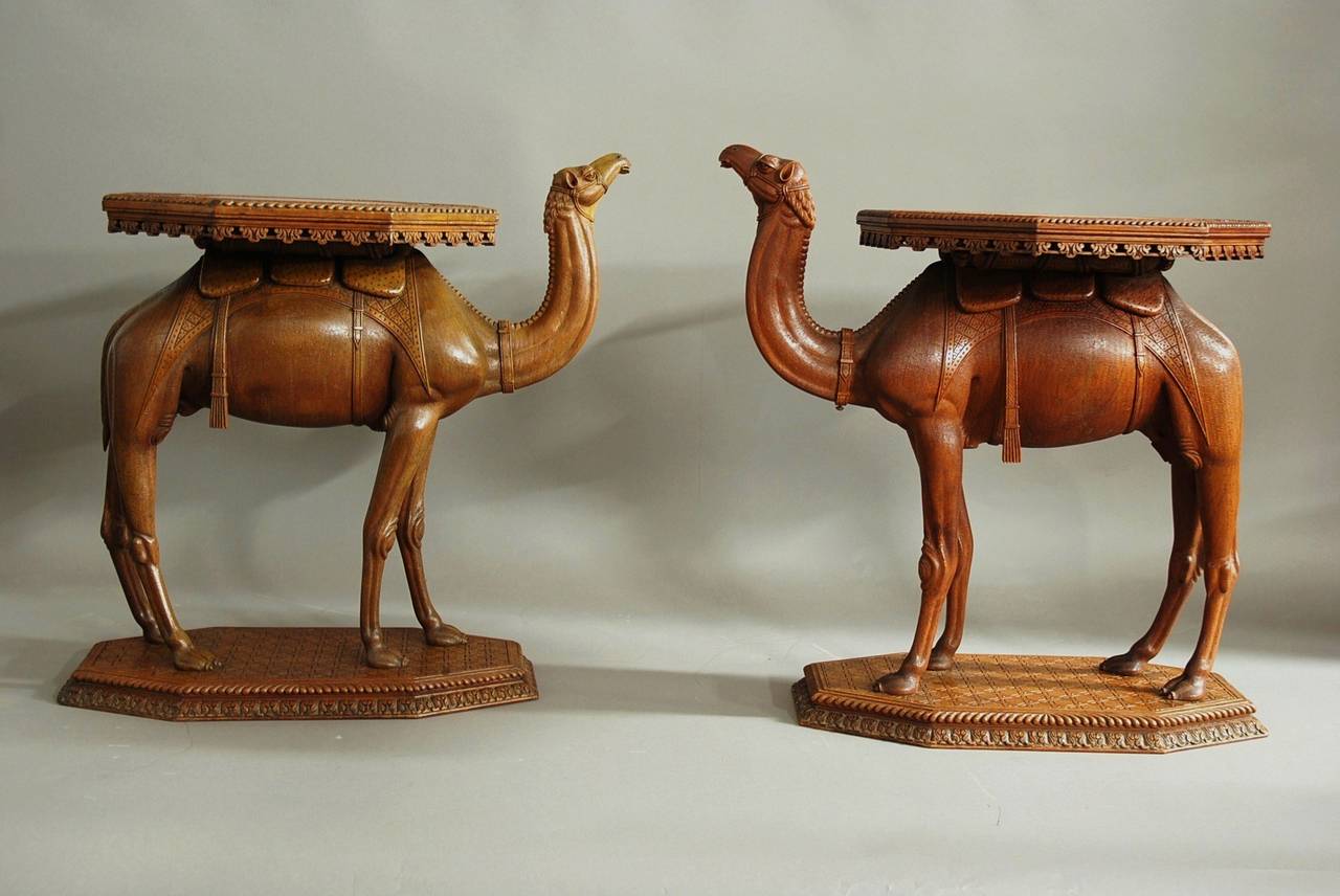 A near pair of late 19th-early 20th century Anglo-Indian hardwood camel tables of superb quality and good patina, possibly from the Gujarat region. 

These tables both have an octagonal top with a plain central section, surrounding with a