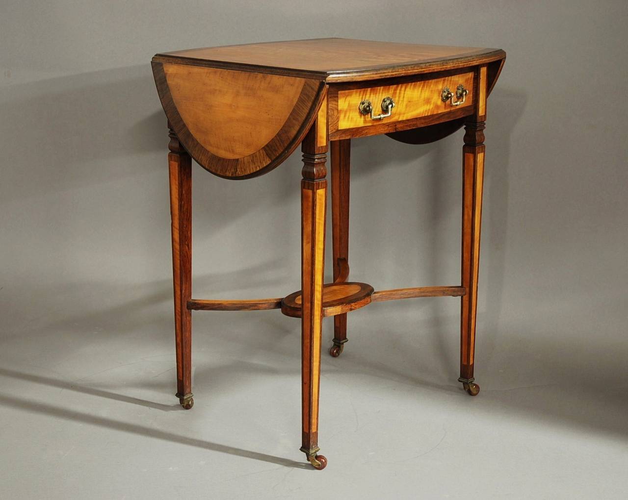 20th Century Edwardian satinwood & rosewood oval pembroke table