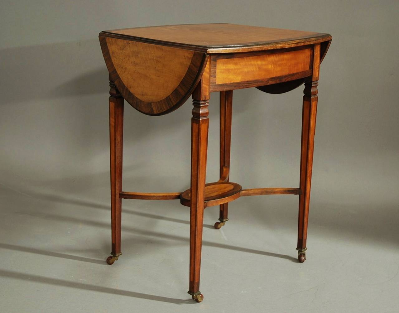 Satinwood Edwardian satinwood & rosewood oval pembroke table