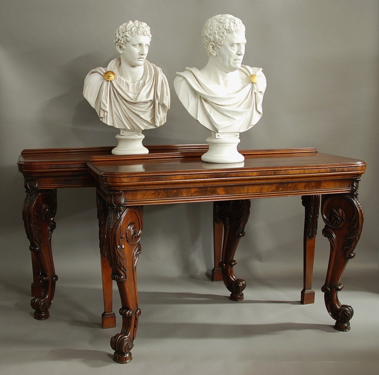 A superb pair of William IV mahogany console tables in the manner of Gillows.

These tables consist of fine quality solid mahogany tops with a low moulding to the back edge (to stop items falling from the back).

The tops have rounded corners