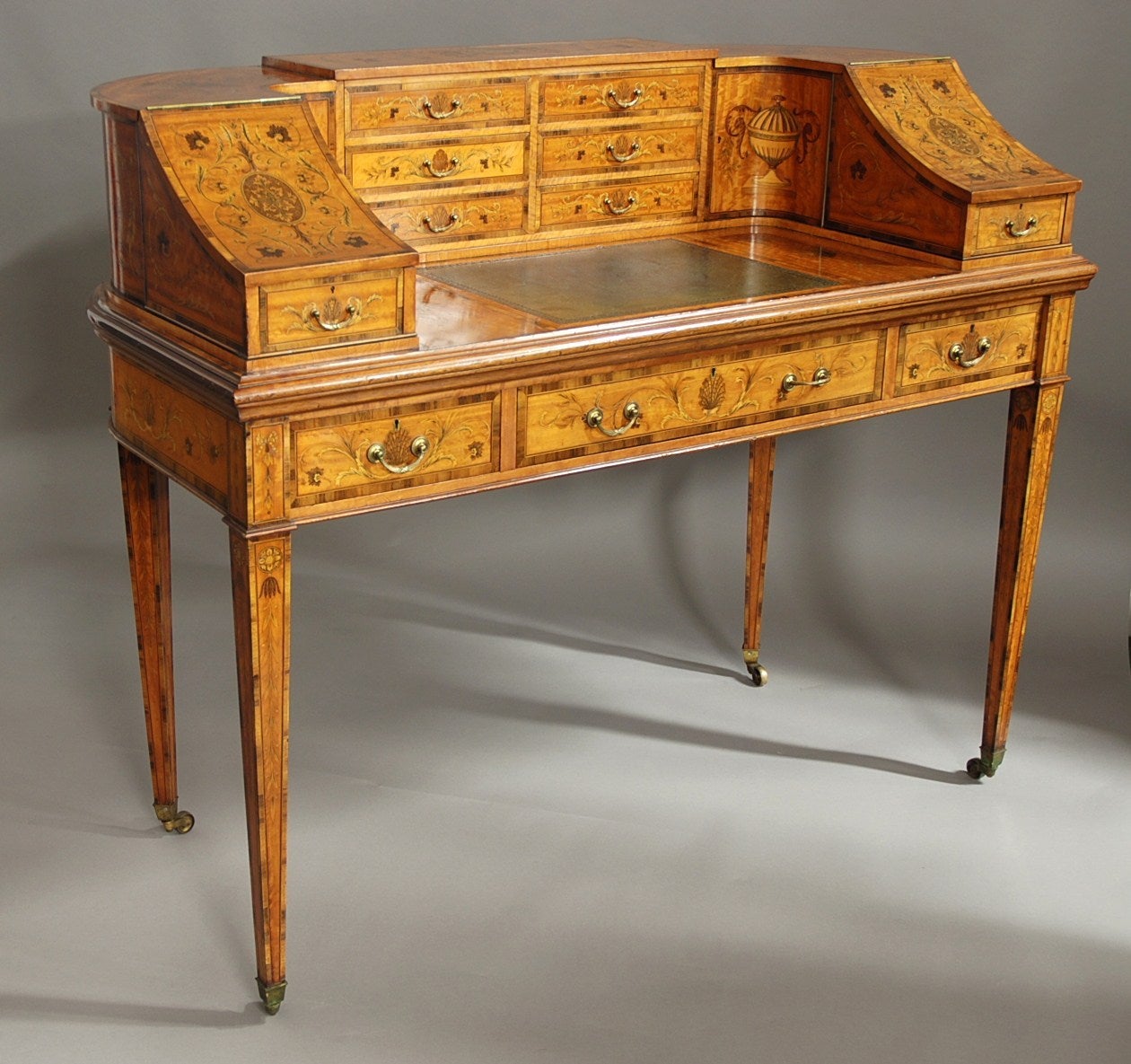 An early 20th century exhibition quality satinwood inlaid Carlton House desk in the Classical form of superb patina, attributed to Edwards & Roberts - ADDITIONAL IMAGES CAN BE VIEWED BELOW:

The desk is completely veneered with finely figured