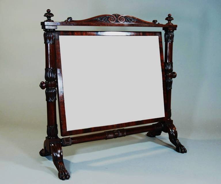 An early 19th century Cuban mahogany cheval dressing glass of superb quality. This piece is in the manner of the cabinet makers Peter Nicholson and his only child, Michael Angelo. This is an exceptionally rare model, being a design book piece of