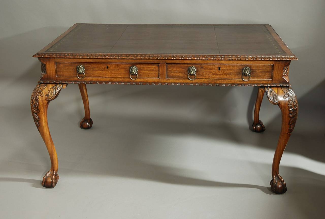 A late 19th century fine quality mahogany Chippendale style writing table of good proportions stamped S&H Jewell, Holborn.

This writing table consists of a brown leather tooled top (recently replaced) with a finely carved moulding to the