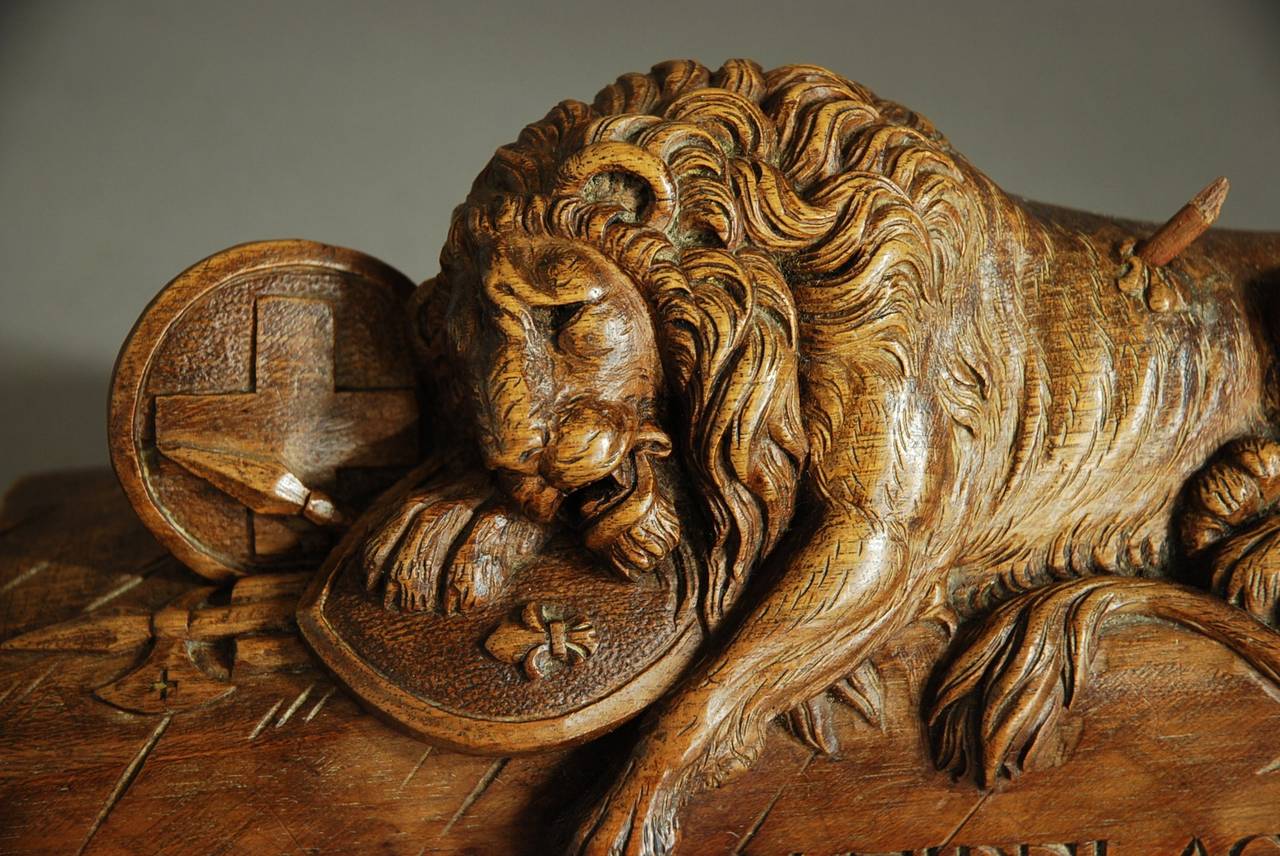 A fine quality late 19th century Black Forest linden wood carving of a lion, depicting the lion of Lucerne. 

This carving is based on the stone lion monument in Lucerne, Switzerland originally designed by the Danish sculptor Betel