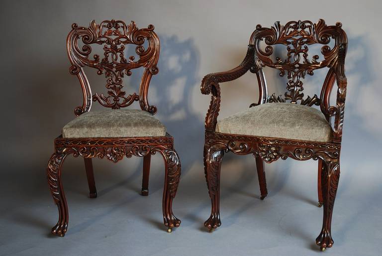 A superb rare set of six highly decorative early 19th century padouk Anglo-Indian chairs, possibly from the Goa or Bombay districts of India. 

This decorative set consists of three armchairs and three single chairs. 

The backs comprise of