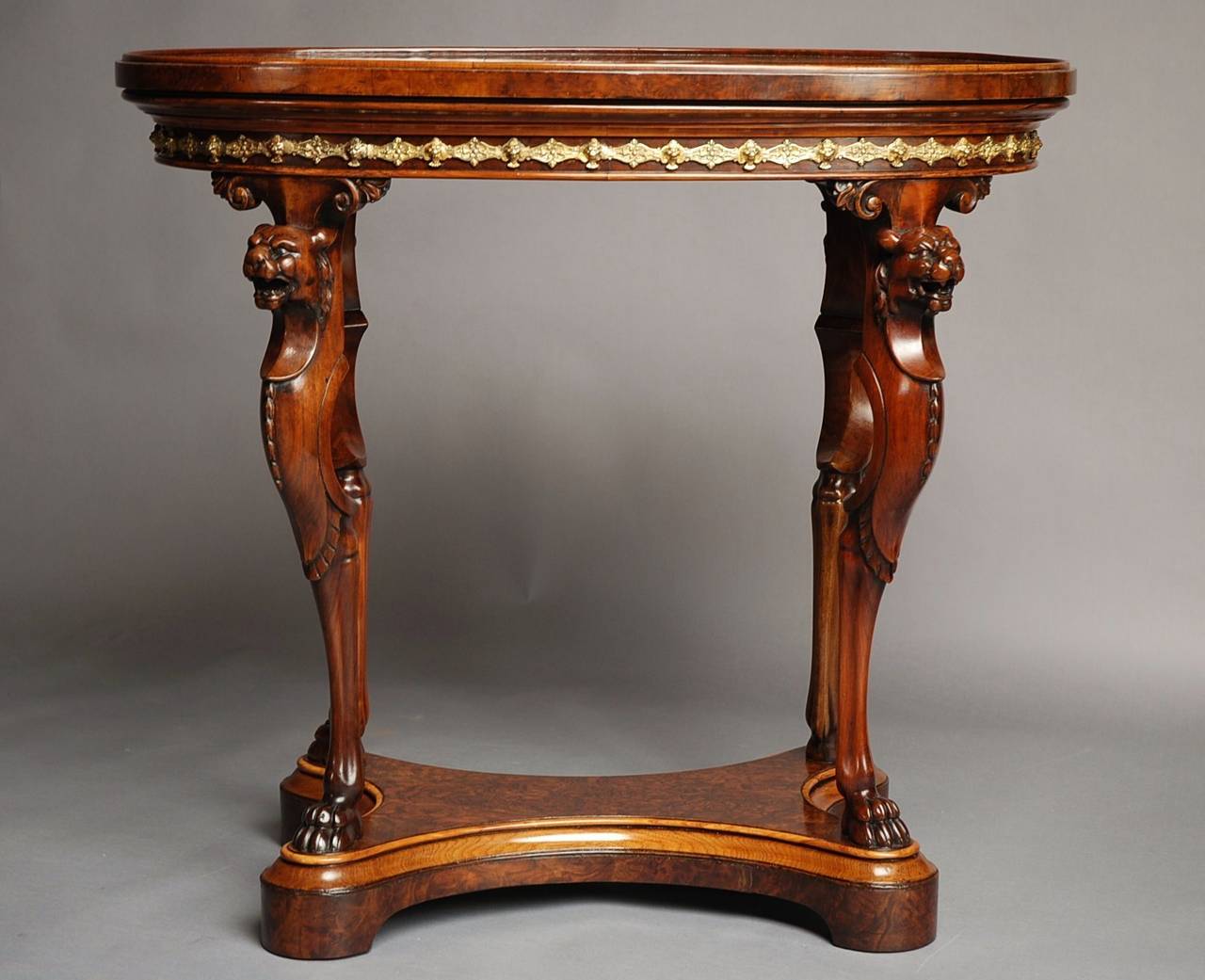 A rare mid-19th century burr walnut centre table of superb quality by Holland & Sons, designed by the architect Gottfried Semper (1803-1879) recently acquired from a private collection and in the same important titled family estate since it was