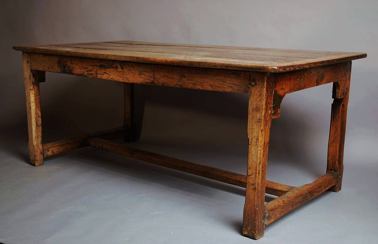 A Welsh late 18th century oak farmhouse table of superb patina with a reversible top and in good, original condition.

This table has a four plank top with cleated ends, the top is reversible which was common for this period as the top could be