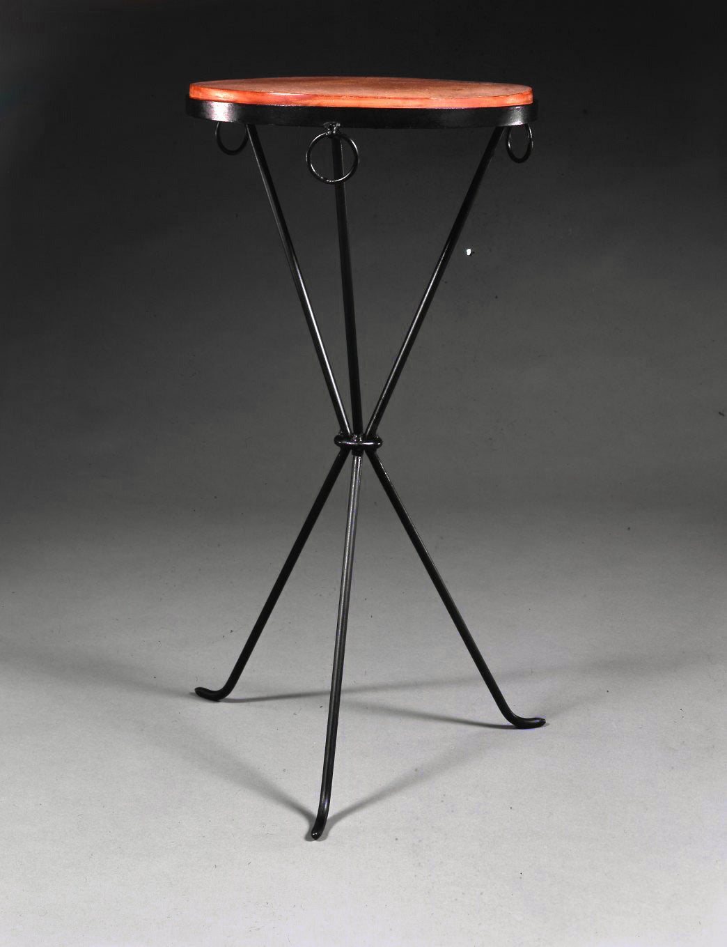 Black patinated wrought iron pedestal table with tripod feet.
The top ornamented with three rings receives a terracotta plate.

Bibliography: Jean Michel Frank, Le´oplod D. Sanchez, Ed du Regard, 1997, pp. 146,199 et 208.

Certificate of