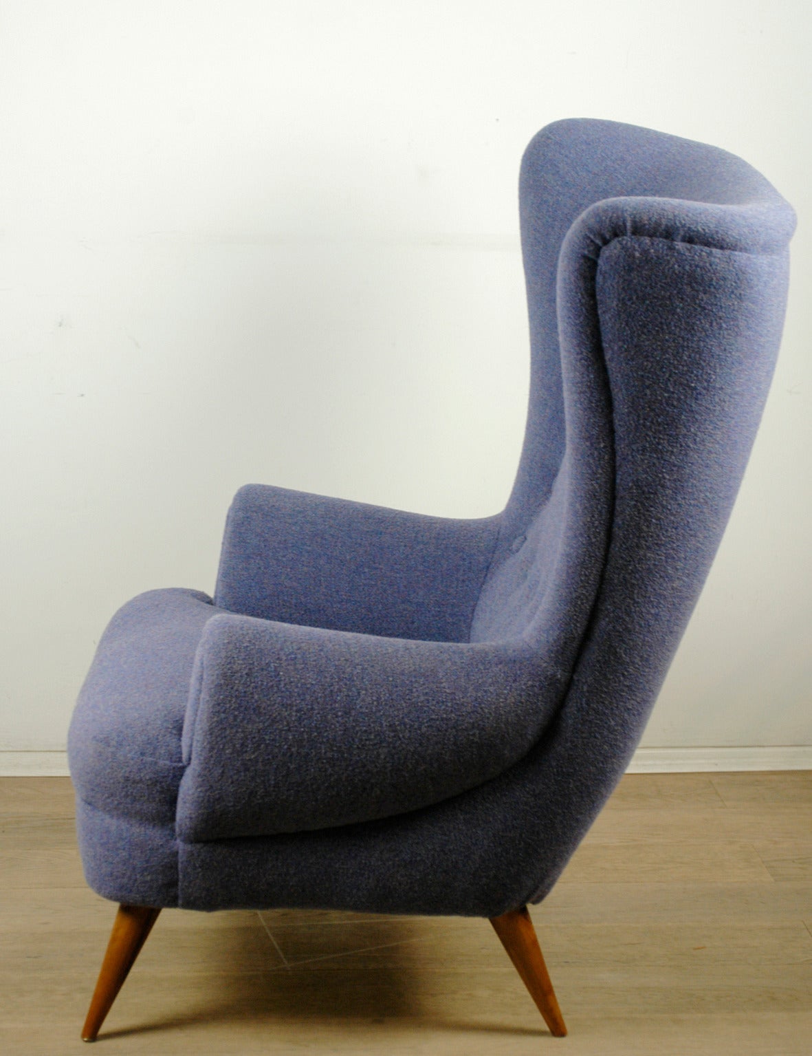 Amazing and comfortable Austrian 50s Lounge Chair designed by the Austrian Post War Architect Oskar Payer, Wooden Frame with Walnut Legs, completely restored and uoholstered with a new violet KVADRAT fabric.