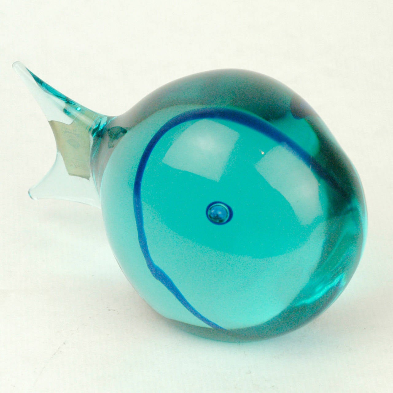Amazing blue Murano glass fish with original old manufacturer's label.

Antonio da Ros was Cenedese's art director in the 1950s and 1960s, he is famous for his designs for vases and glass animals in the 