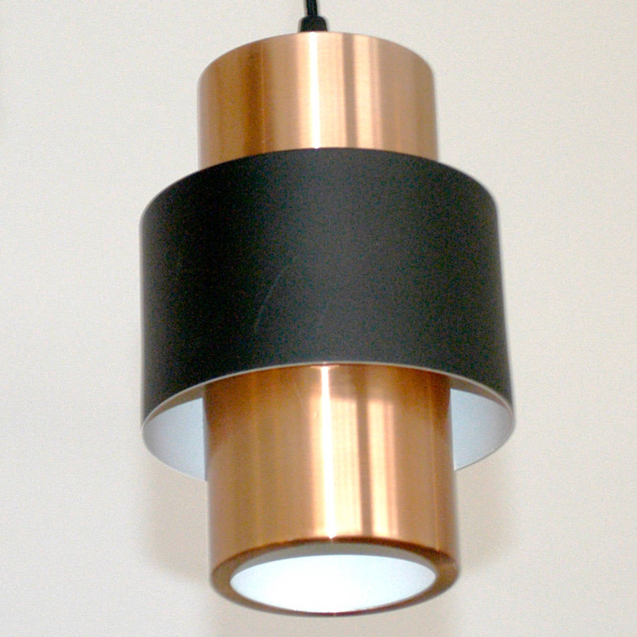 Scandinavian modern pendant lights with copper and black lacquered metal, perfect addition to any modern or Mid-Century Modern interior!
Two pieces available, also as single.