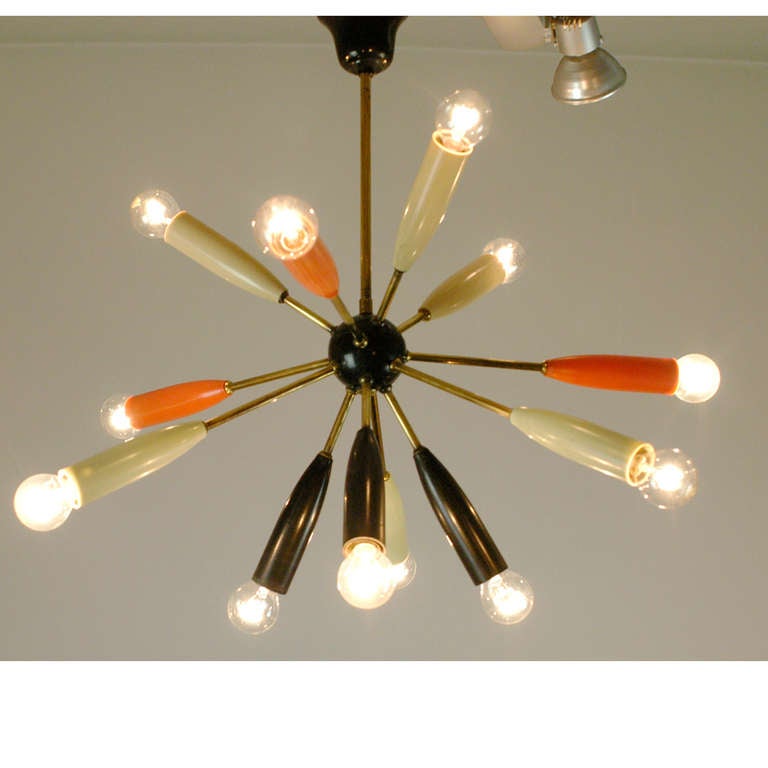 Charming Italian midcentury sputnik hanging light in the style of Stilnovo with<br />
nine lights.<br />
One small repair you can see on the photo.