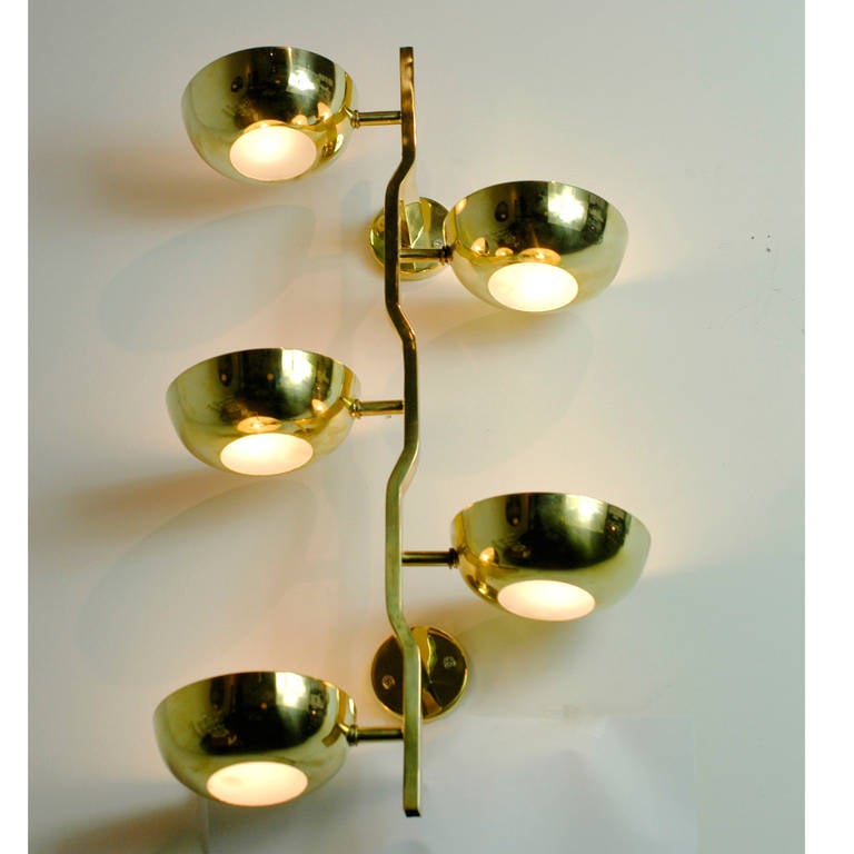 Amazing Italian 1950s brass wall light with five E 14 bulb sockets and opaline perspex glass in the style of Gino Sarfatti.
Every single shade can be turned either to the wall or to the ceiling, wonderful light effects.

This rare and organic