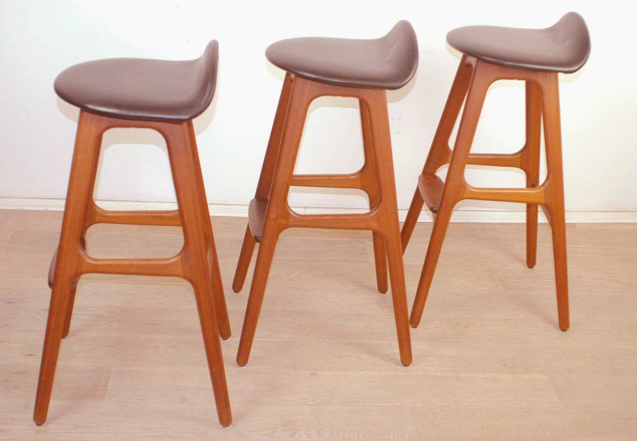 Three danish teak Barstools with black skai seats and rosewood footrests;
matching Dry Bar available- Perfect Highlight for any Mid Century Modern Home.