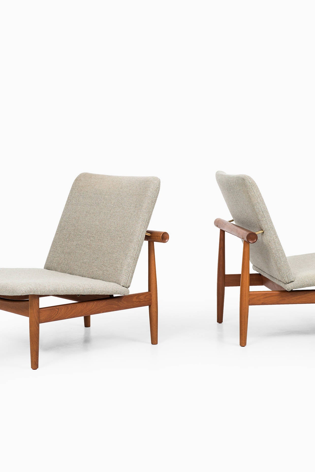 A pair of easy chairs model Japan / FD-137 designed by Finn Juhl. Produced by France & Son in Denmark.