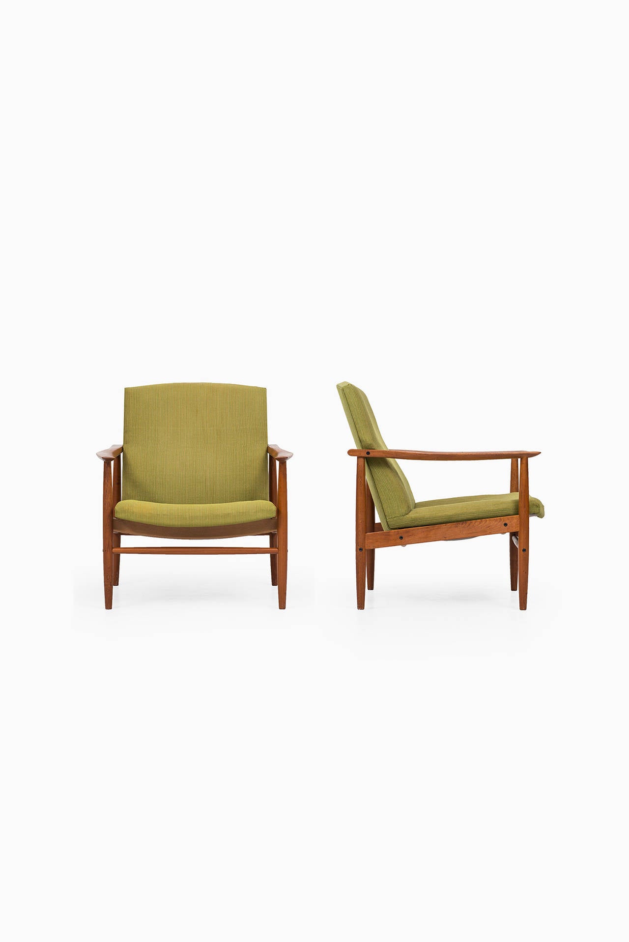 Mid-Century Modern Mid century pair of easy chairs in teak probably produced in Denmark