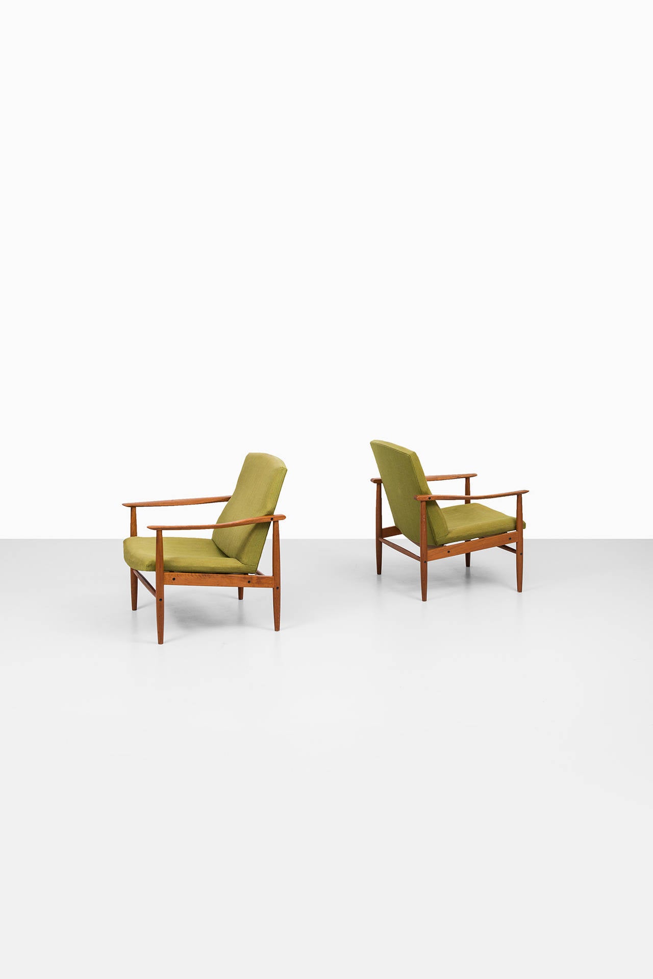 Mid century pair of easy chairs in teak probably produced in Denmark 1