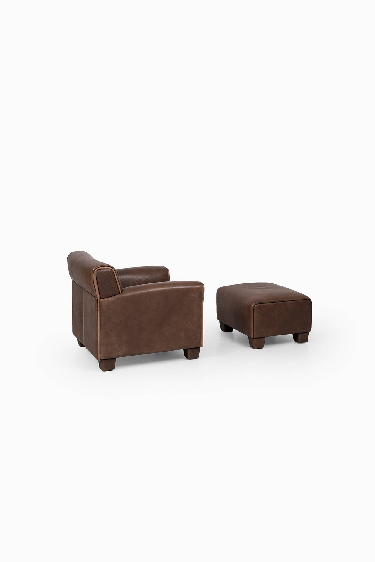 Leather de Sede easy chair with stool by de Sede in Switzerland
