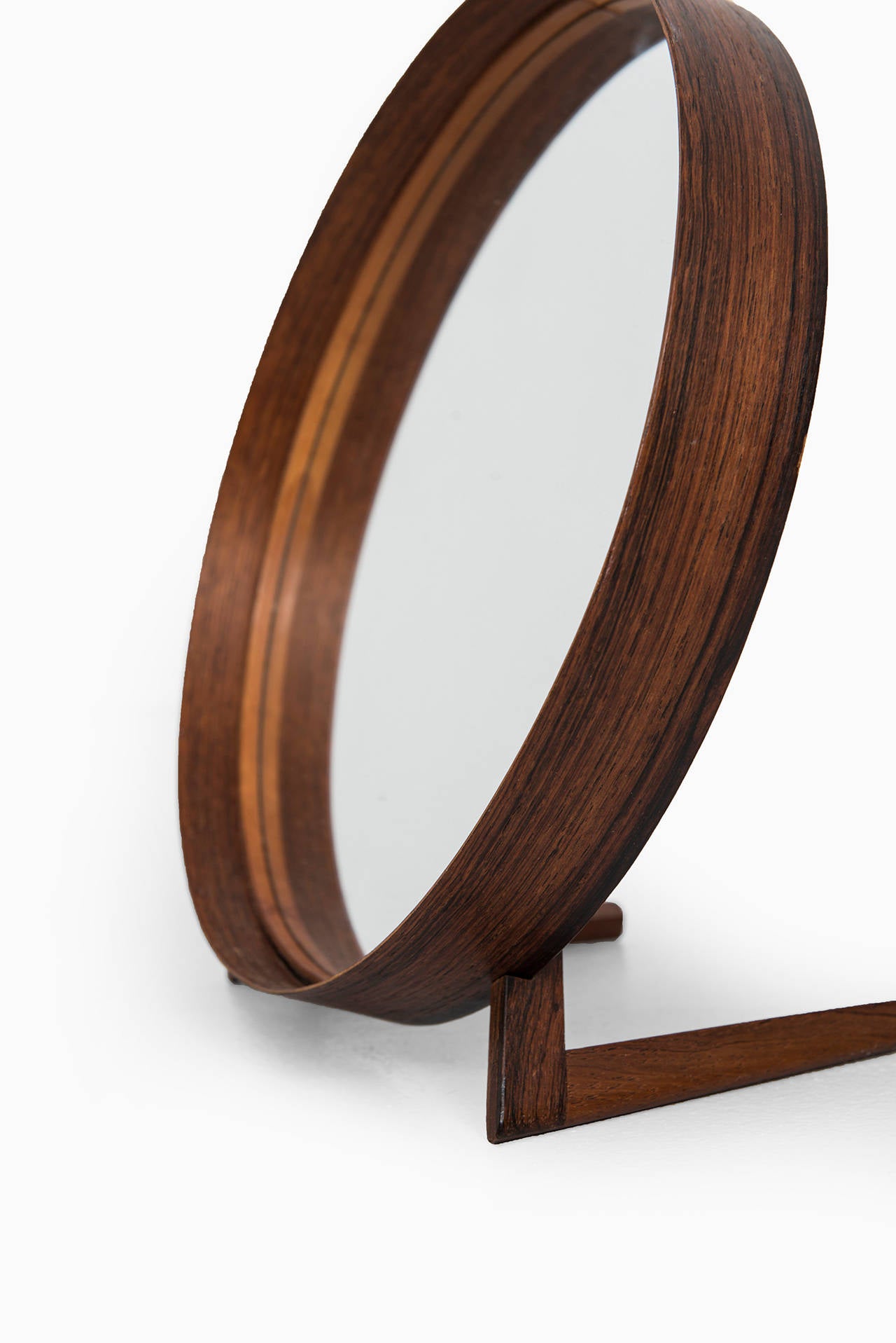 Rare table mirror in rosewood and brown leather designed by Uno & Östen Kristiansson. Produced by Luxus in Vittsjö, Sweden.
