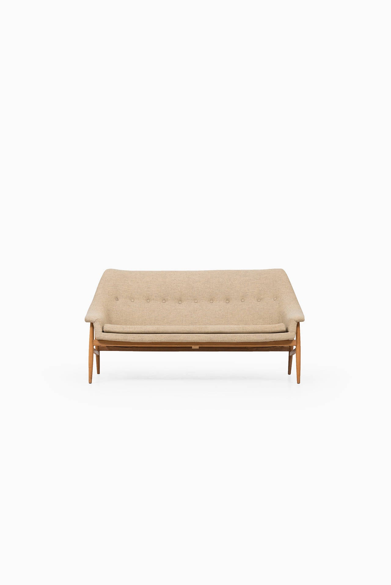 Rare mid century sofa in the style of Ib Kofod-Larsen. Probably produced in Denmark.