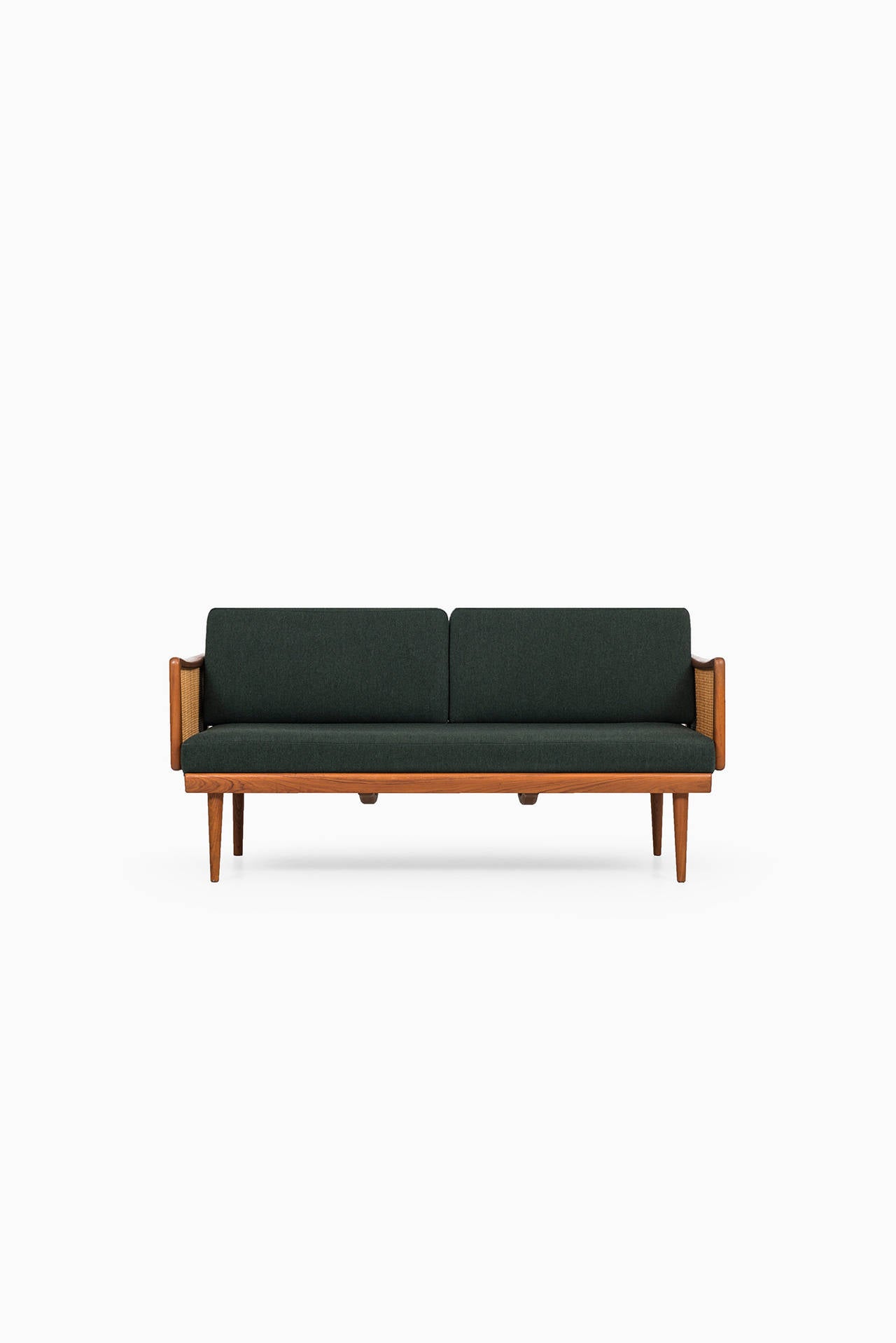 Rare sofa / daybed model FD 451 designed by Peter Hvidt & Orla Mølgaard-Nielsen. Produced by France & Daverkosen in Denmark. Teak frame, with woven cane details. Dark green original upholstery.