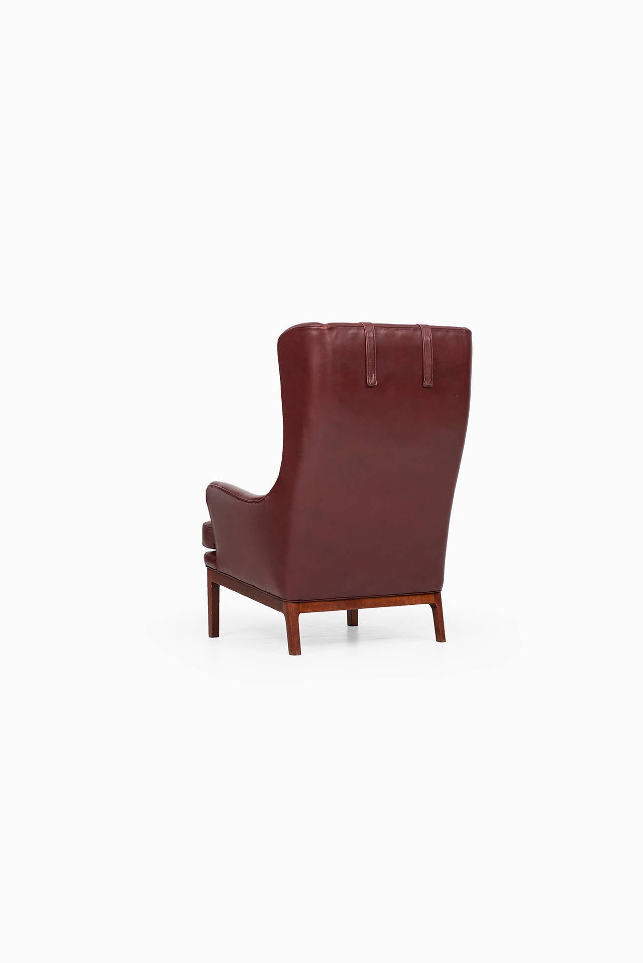 Mid-20th Century Arne Norell Wingback Easy Chairs in Dark Red Leather by Norell AB in Sweden