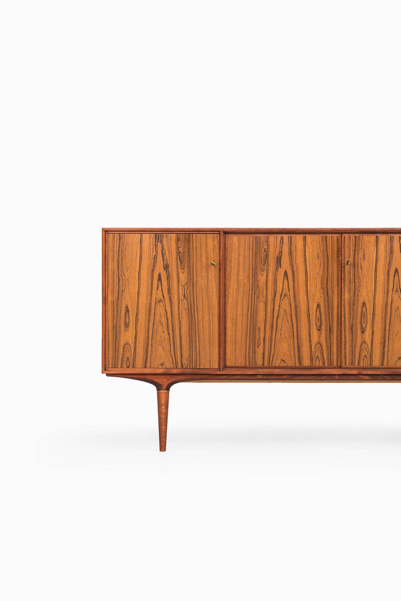 Rare sideboard model Cortina in rosewood and brass designed by Svante Skogh. Produced by Seffle möbelfabrik in Sweden.