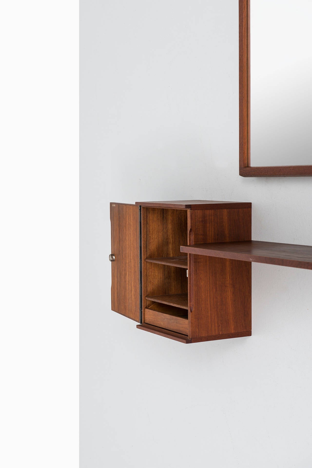 Rare hall furniture with mirror in teak designed by Hans-Agne Jakobsson. Produced by Hans-Agne Jakobsson in Åhus, Sweden.