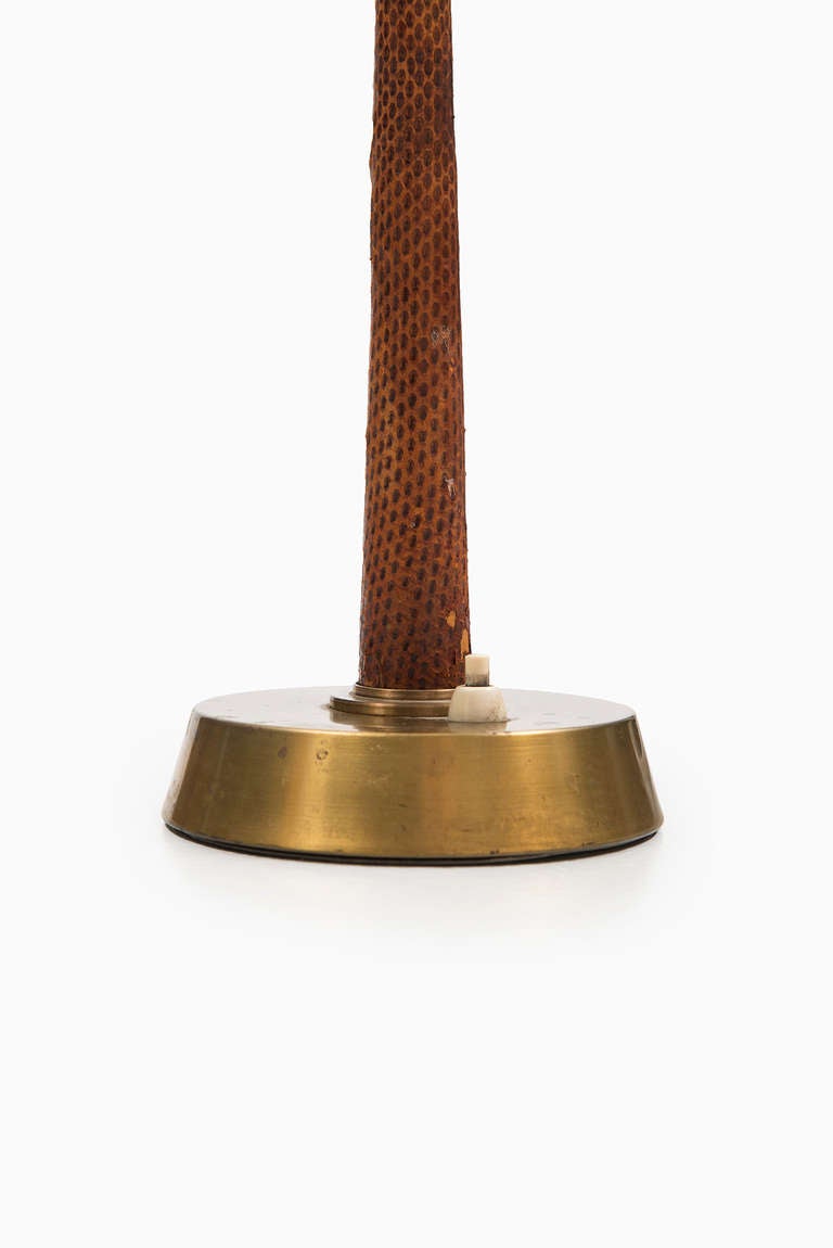 Rare midcentury desk lamp in brass with snakeskin imitation. Produced by AB E. Hansson & Co in Malmö, Sweden.