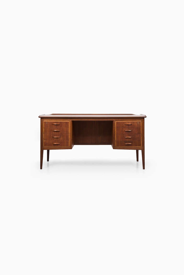 Svend Aage Madsen desk in teak produced by H.P Hansen in Denmark.