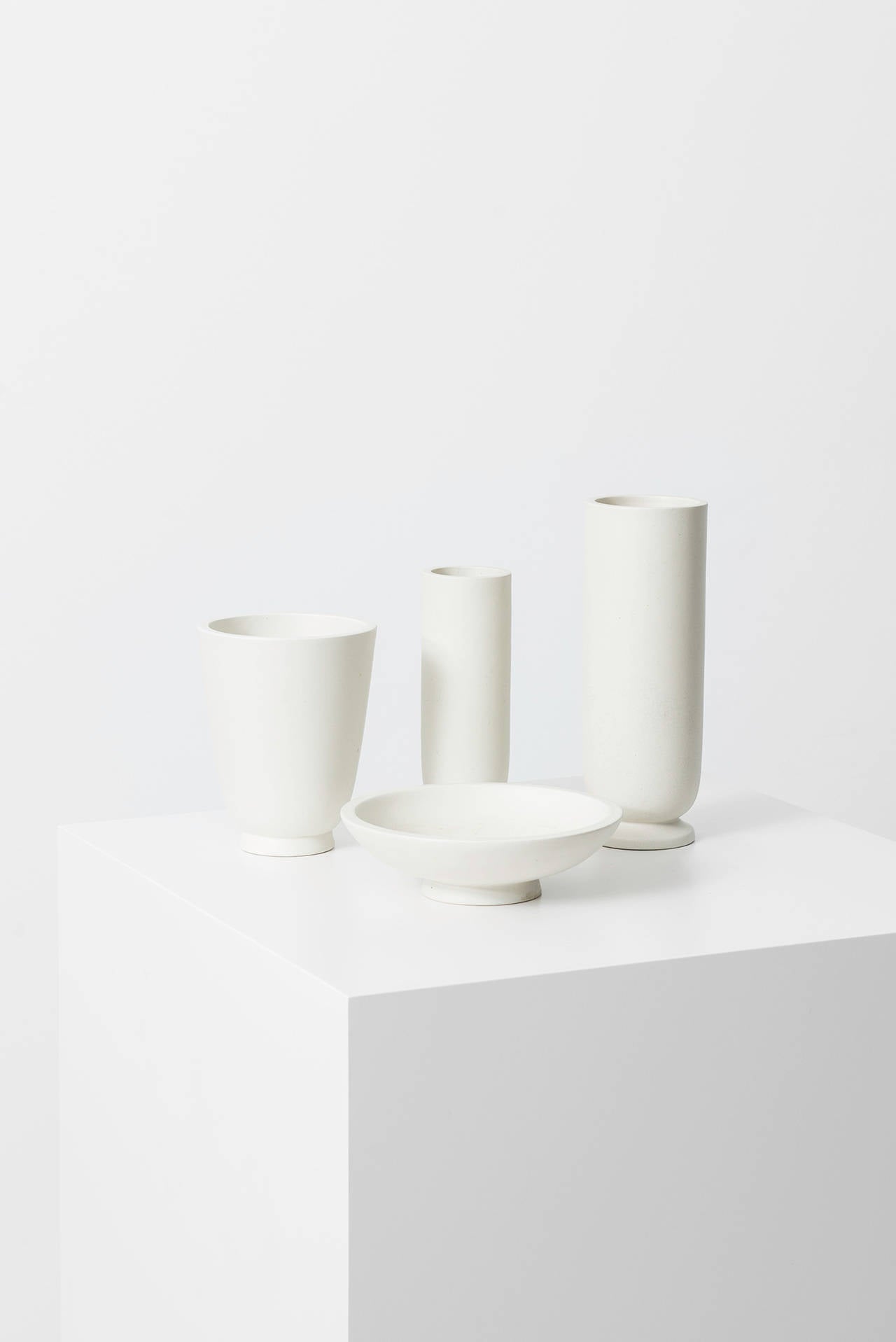 Set of four stoneware vases designed by Wilhelm Kåge. Produced by Gustavsberg in Sweden. 

Dimensions (W x D x H): 12 x 12 x 15 cm
Dimensions (W x D x H): 6 x 6 x 17,5 cm
Dimensions (W x D x H): 18 x 18 x 5 cm
Dimensions (W x D x H): 8 x 8 x