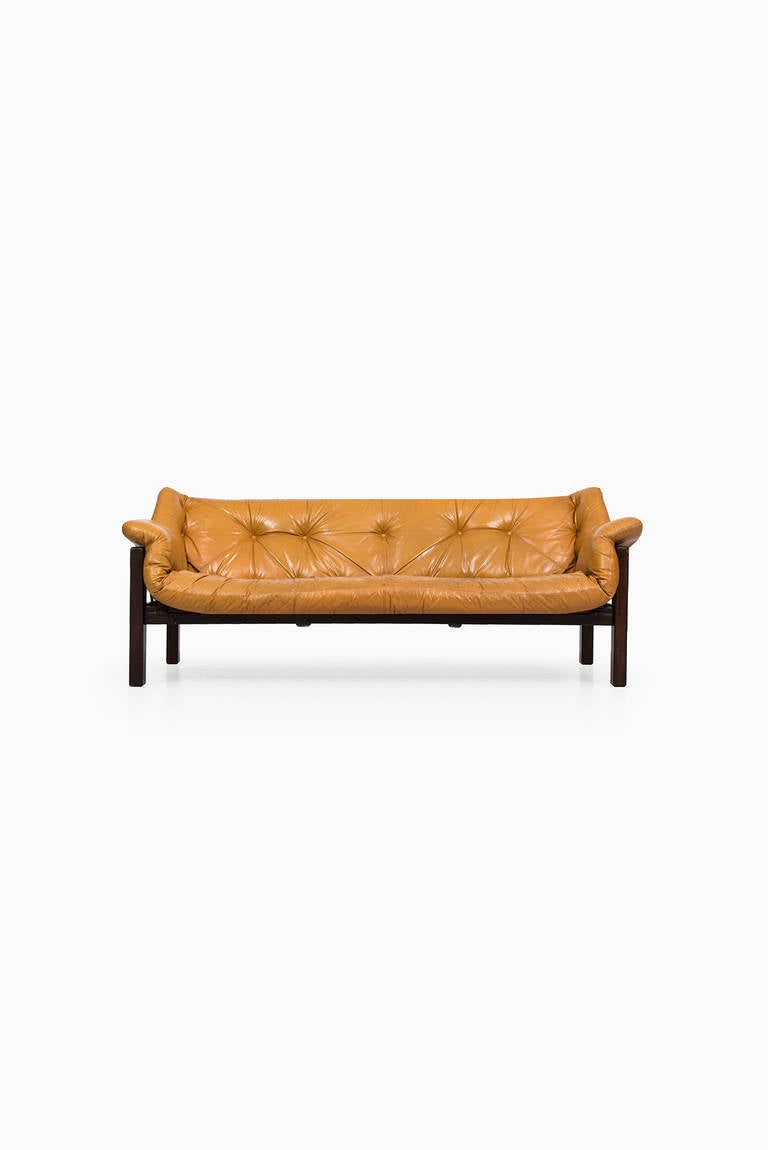 Jean Gillon Amazonas sofa in rosewood and leather. Produced by Wood Art in Brazil.