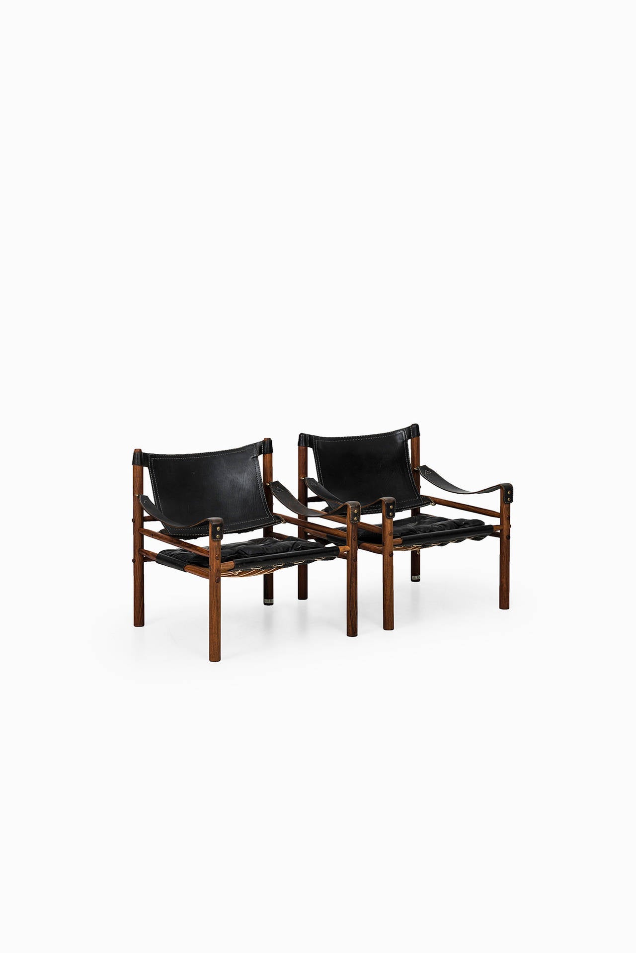 A pair of easy chairs model Sirocco or Scirocco designed by Arne Norell. Produced by Arne Norell AB in Aneby, Sweden.