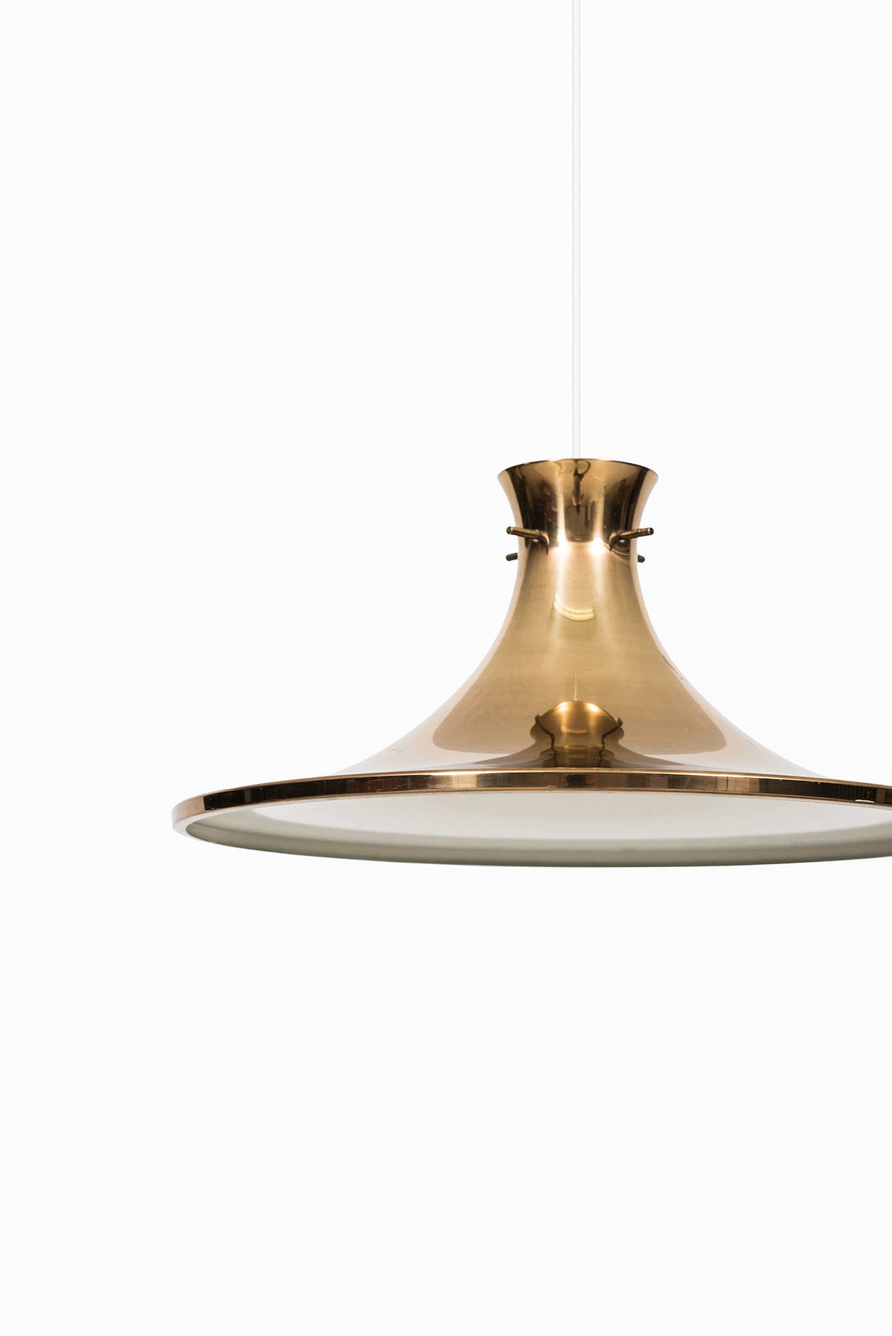 Ceiling lamp in brass designed by Hans-Agne Jakobsson. Produced by Hans-Agne Jakobsson in Markaryd, Sweden.