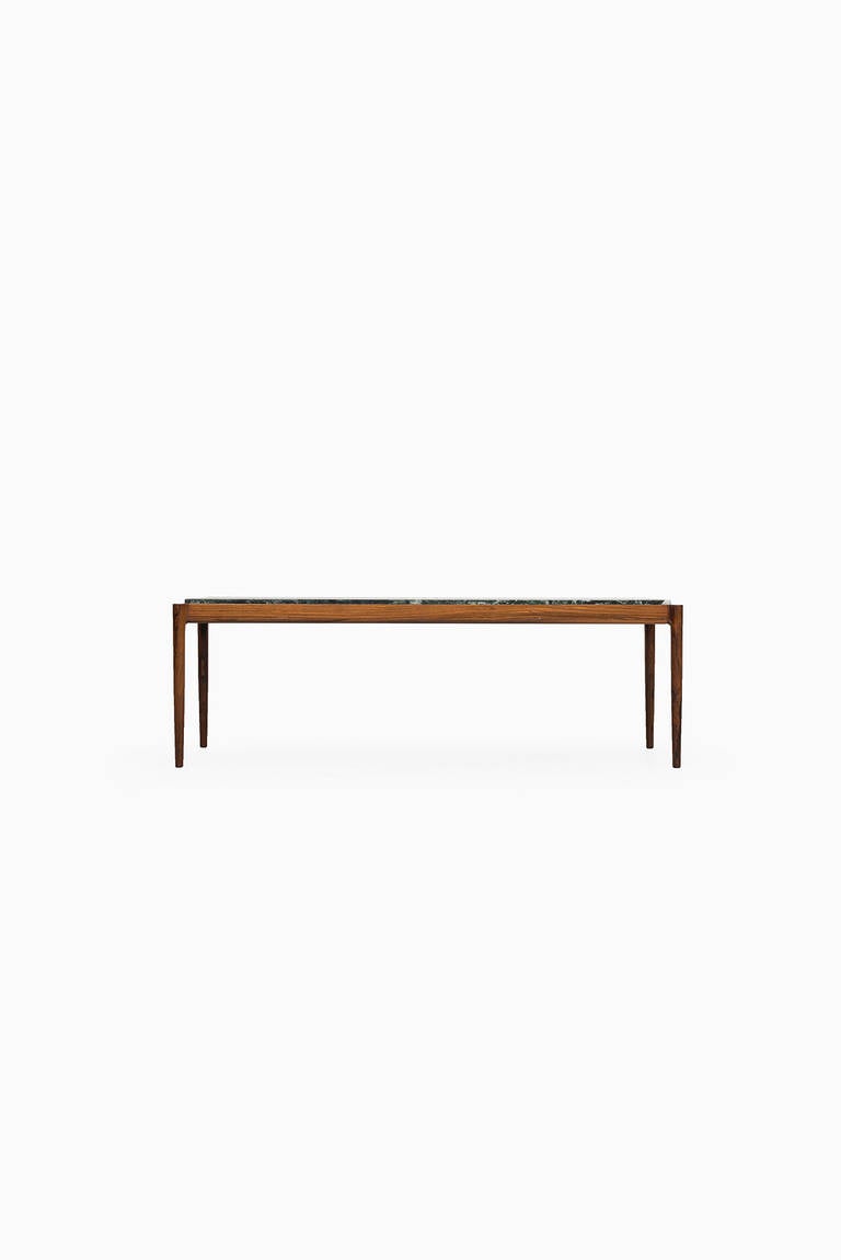 Rare Ib Kofod-Larsen coffee table in rosewood and marble. Produced by Seffle Möbelfabrik in Sweden.