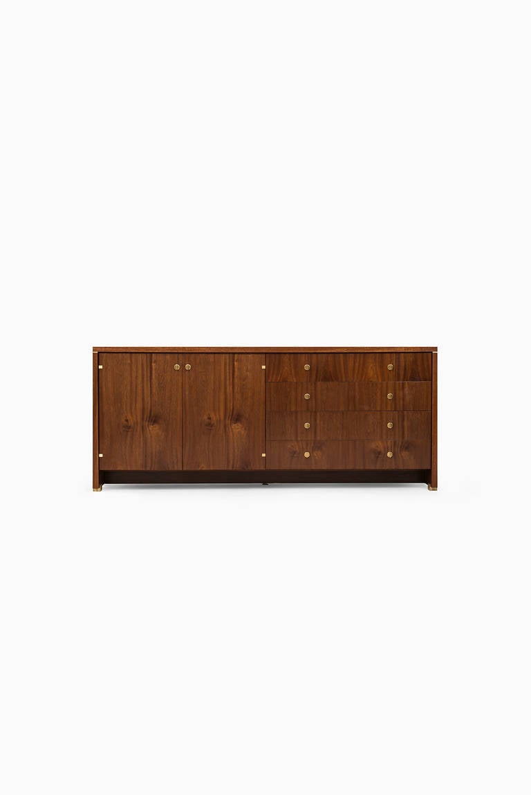 Mahogany sideboard with brass details in the manner of Pierre Cardin. Probably produced in France.