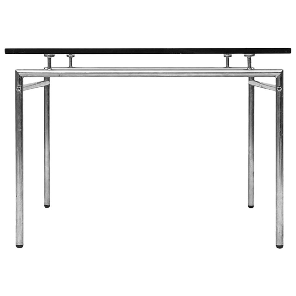 Minimalist low coffee table in chrome and glass