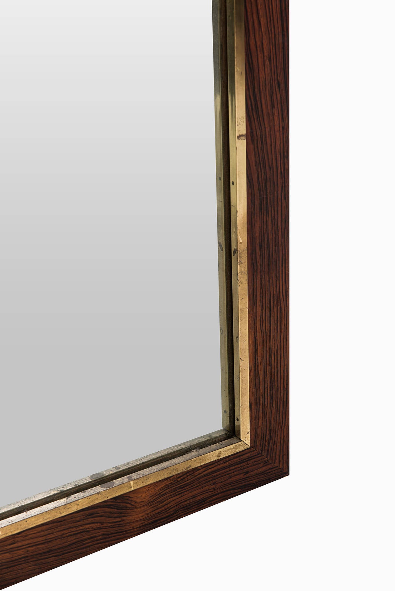 Rosewood Large rosewood mirror with brass detail by Fröseke in Sweden