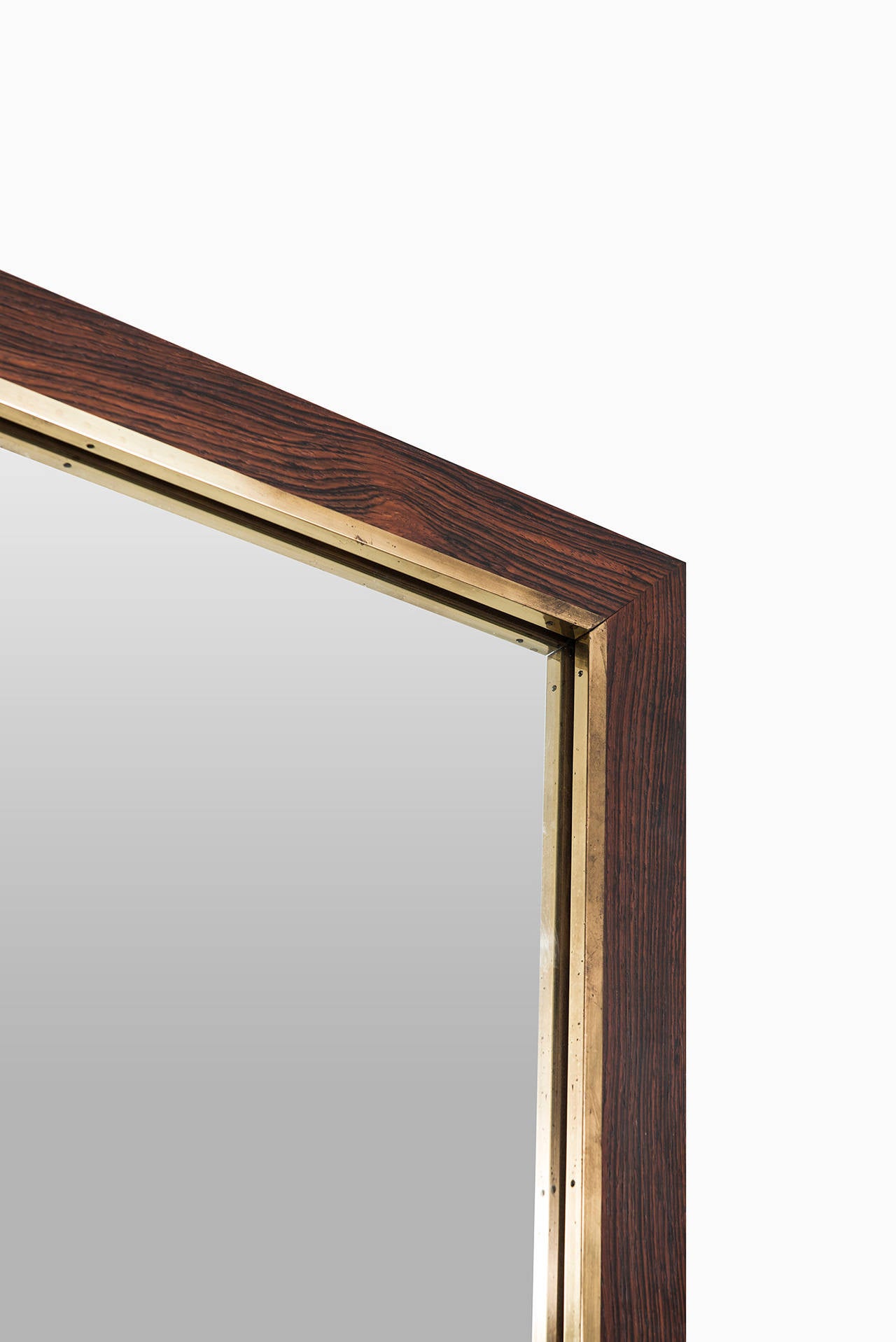 Swedish Large rosewood mirror with brass detail by Fröseke in Sweden