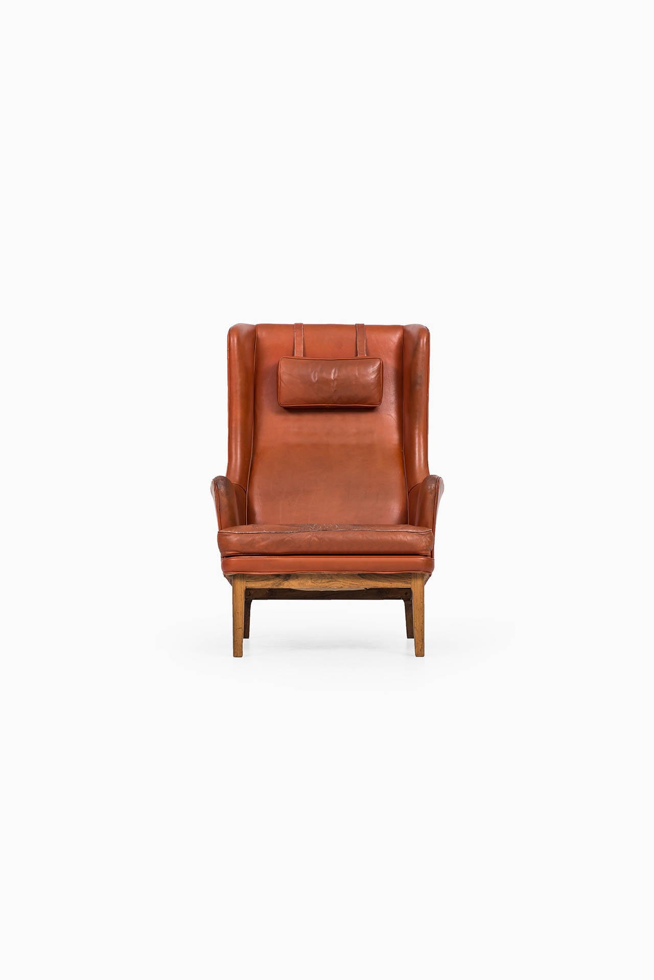 Arne Norell wingback easy chair in rosewood and leather by Norell AB in Sweden 1