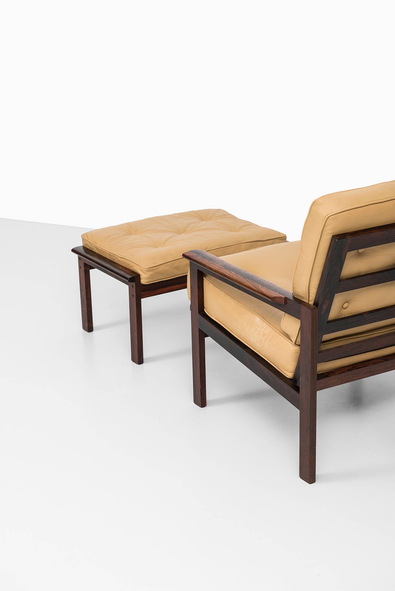 Mid-20th Century Illum Wikkelsø Capella easy chair with stool by Niels Eilersen in Denmark