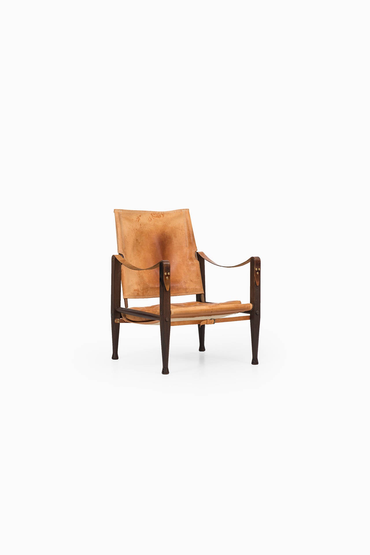 Safari chair in dark stained ash and cognac brown leather designed by Kaare Klint. Produced by Rud. Rasmussen in Denmark.