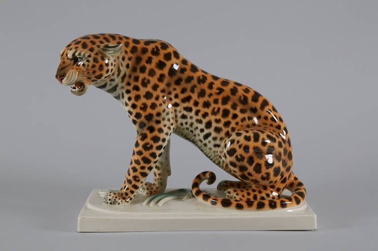 Sitting Leopard by Arthur Storch for Schwarzburger Werkstätten 1921.
Model number U1221. Signed artist initials AS  on the base.
Porcelaine underglaze painting.