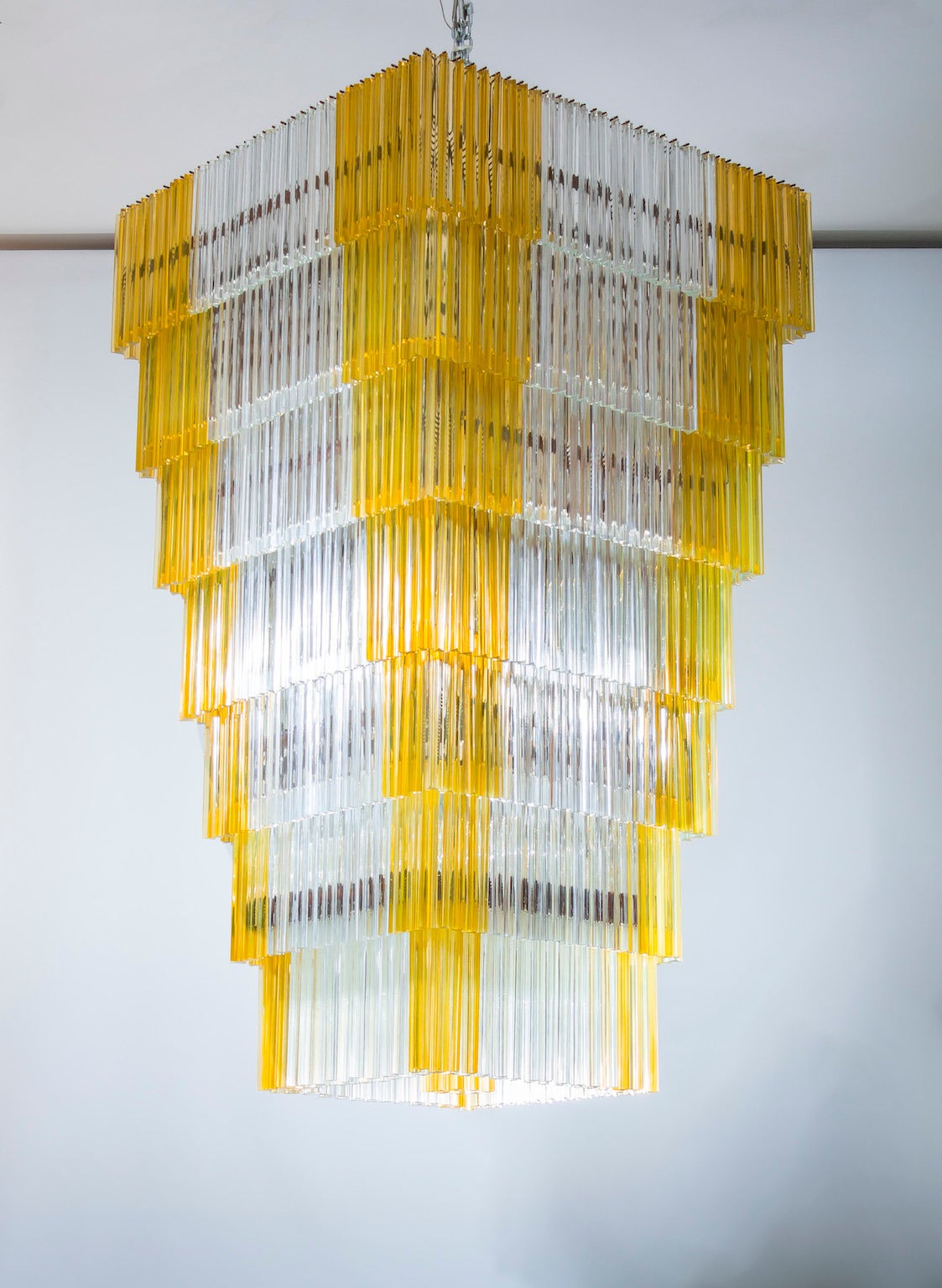 Spectacular and amazing Italian Murano chandelier, attributed to Venini, circa 1960s, composed at the corners from Triedro elements with amber soul, and in the middle part from transparent Triedro elements, disposed in a phenomenal shape Cascade