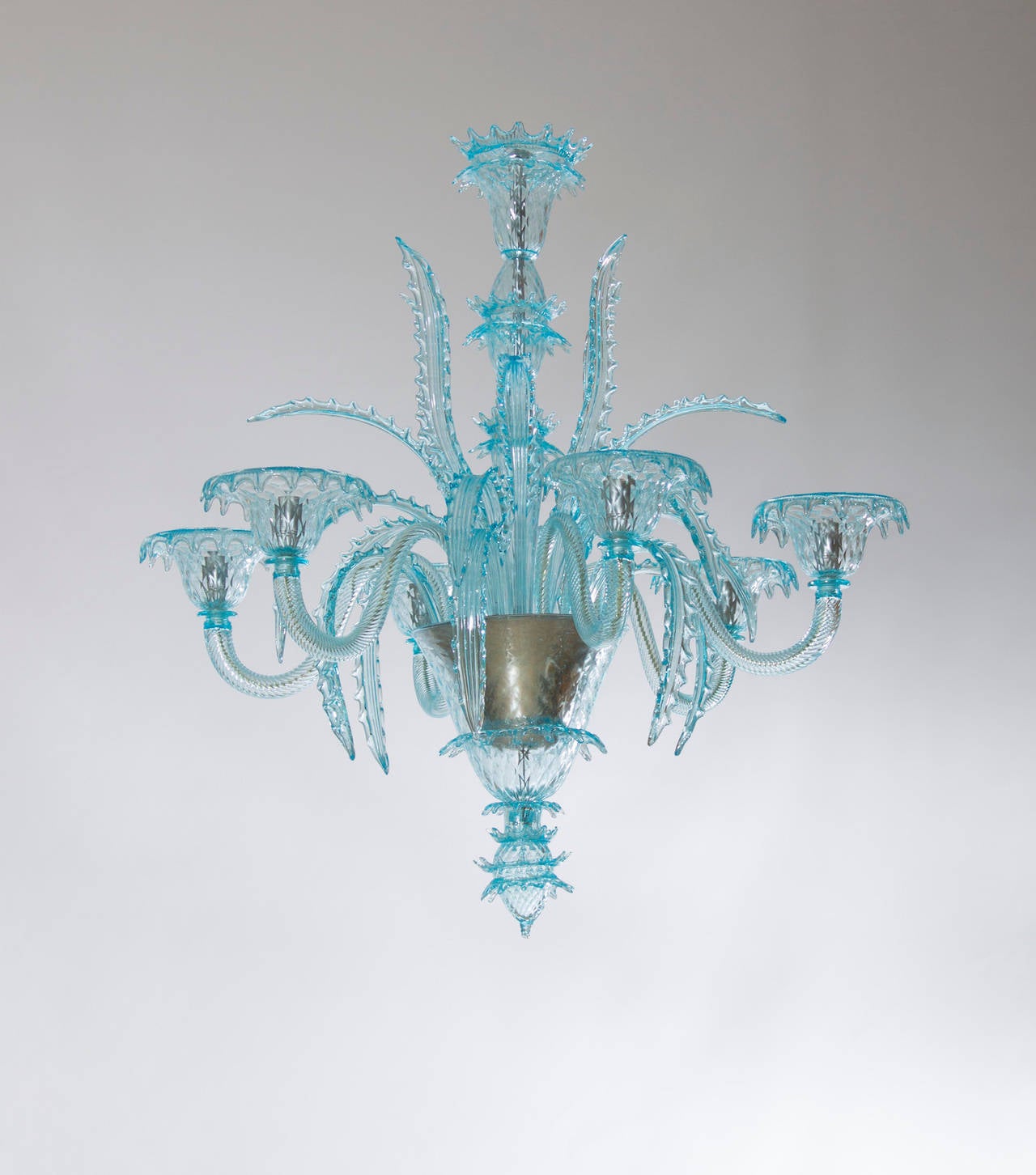 Fantastical Italian light-blue chandelier in excellent original condition, attributed to Salviati circa from 1980s, composed of eighteen leafs with a particular design, arranged in three different stages: high, medium, and low, and having six arms