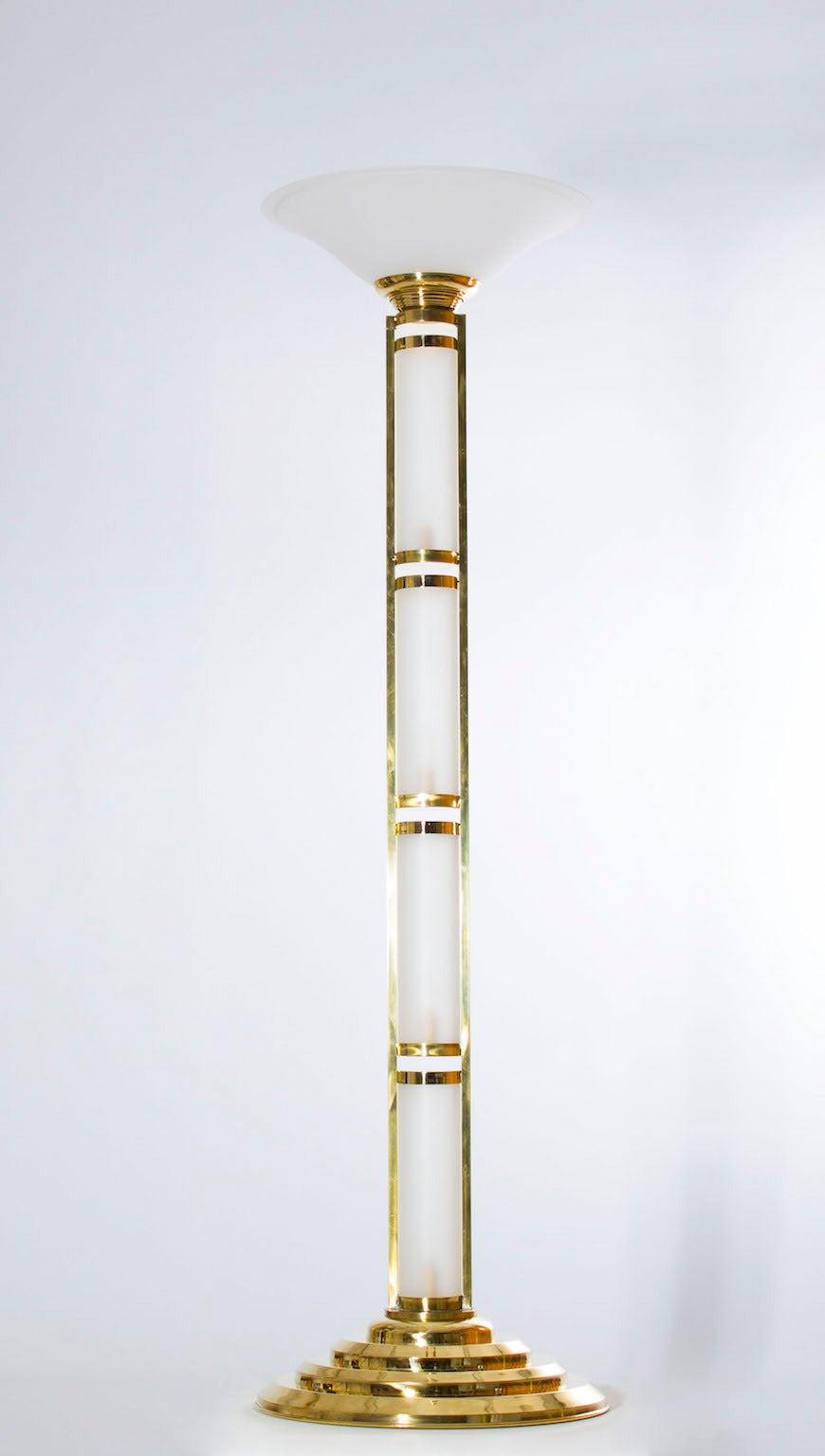 Elegant Murano floor lamps in excellent original condition circa 1960s, composed by four cylinders and a cup in sandblasted glass with a spectacular brass frame. The floor lamps are 77 inch high, by 27 inches diameter and having five lights.

We